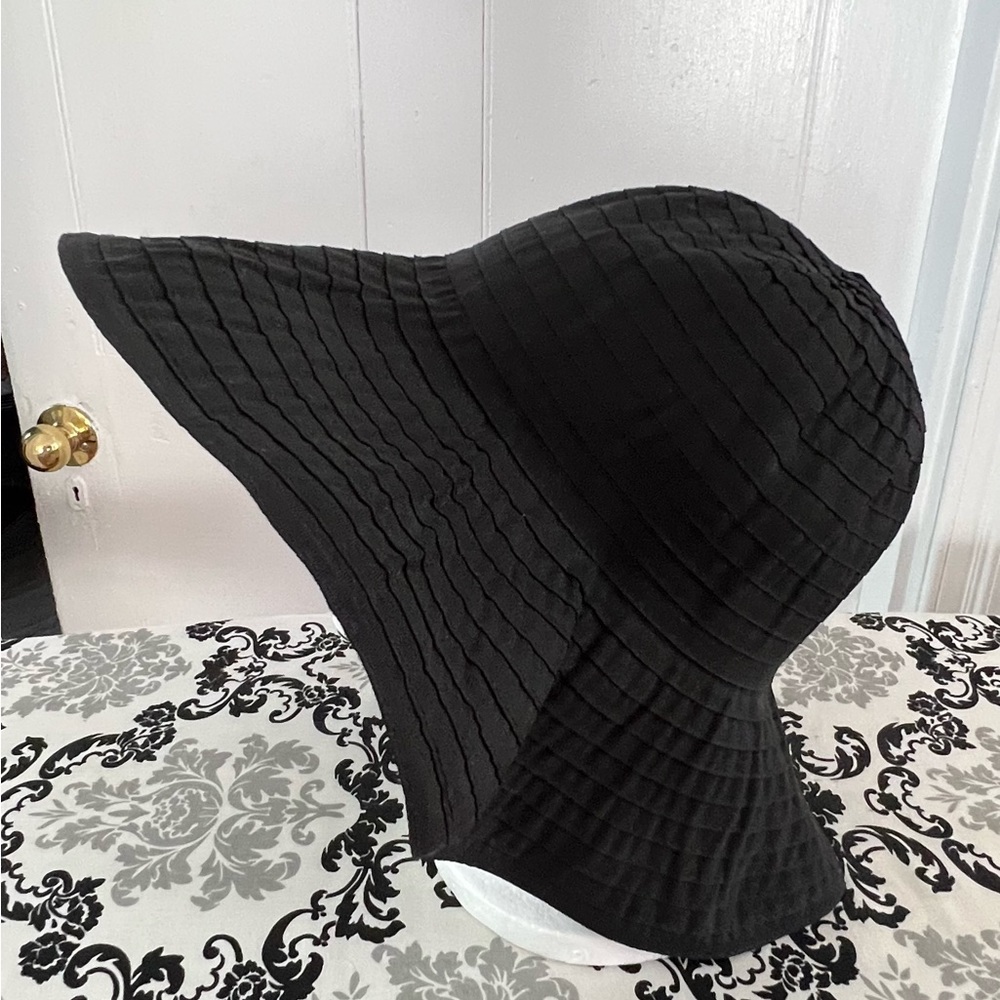 Black floppy sun hat. One size fits all. Minimal wear